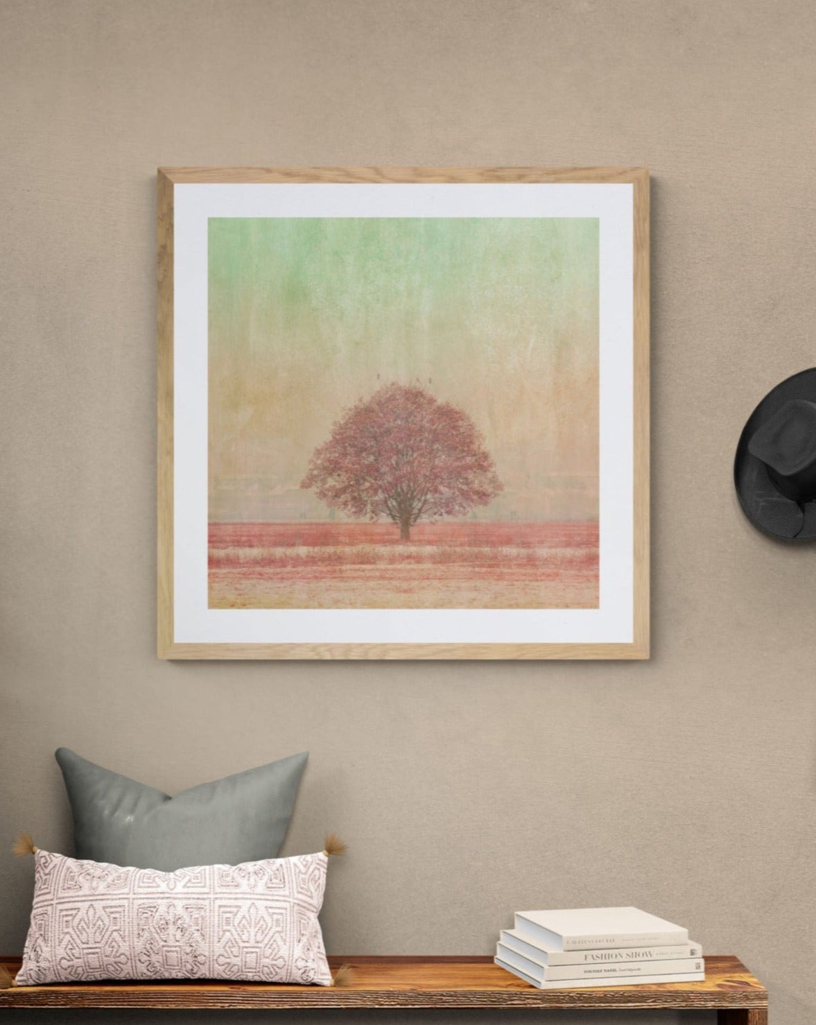 large photograph of pink tree and green sky.